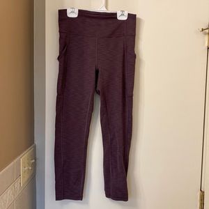 Never worn Lululemon size 6 leggings cropped - plum colored